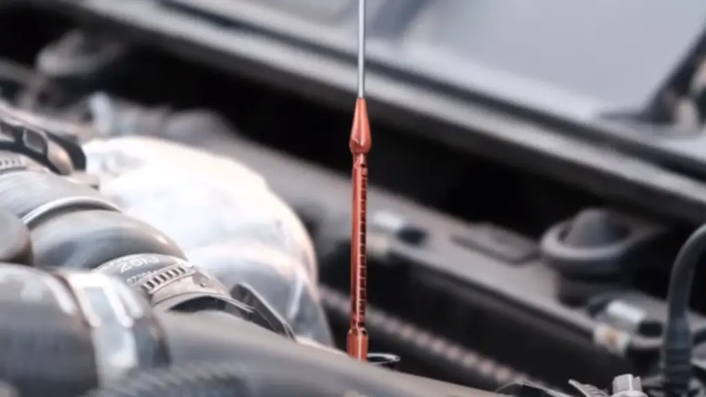 checking oil level with dipstick